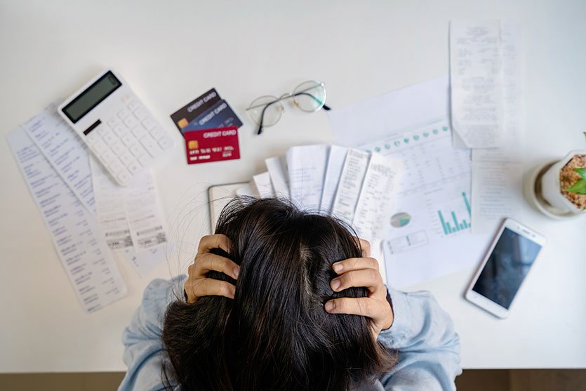 Woman stressed looking for tax debt relief options